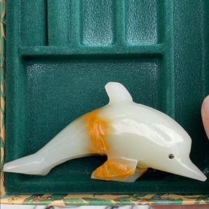 Stone carved dolphin figurine